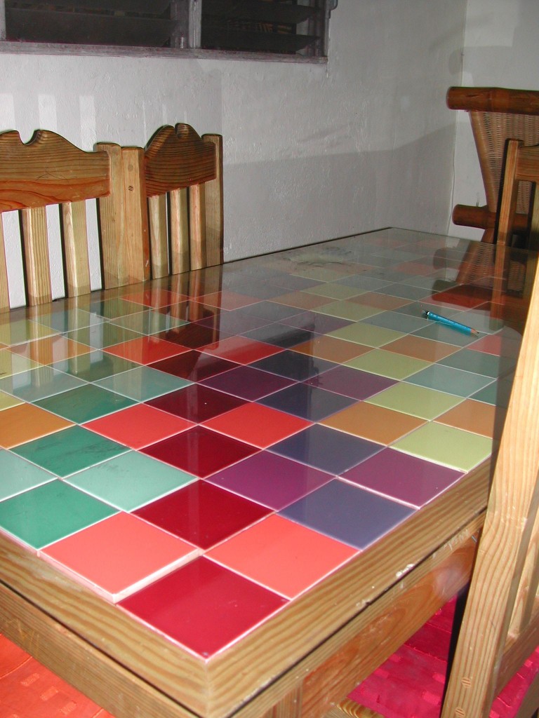 I designed this table with interchangeable tiles.